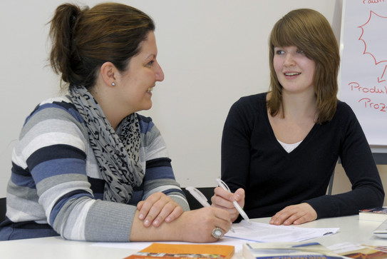 Two women in a counseling situation.