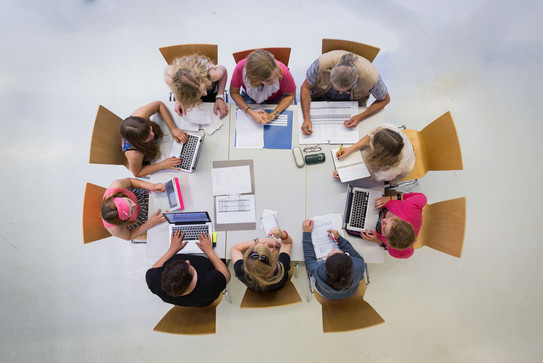Aerial view: people at meeting table