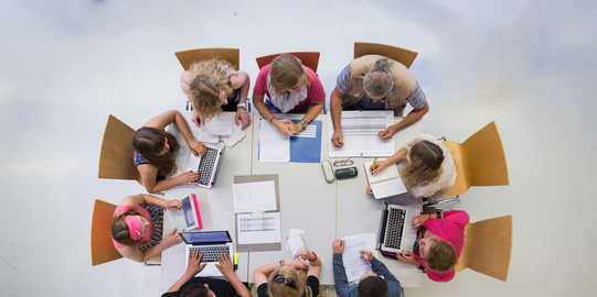 Aerial view: people at a meeting table
