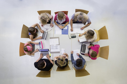 Aerial view: people at a meeting table